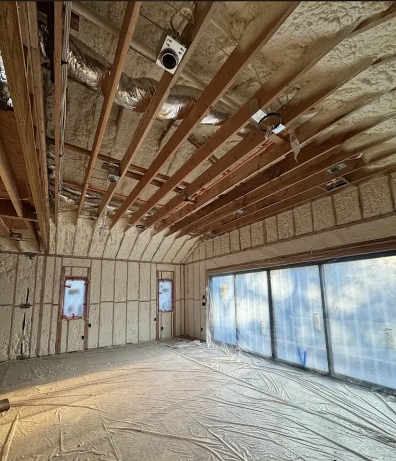 Interior walls and ceiling insulated with spray foam during new construction in Wichita